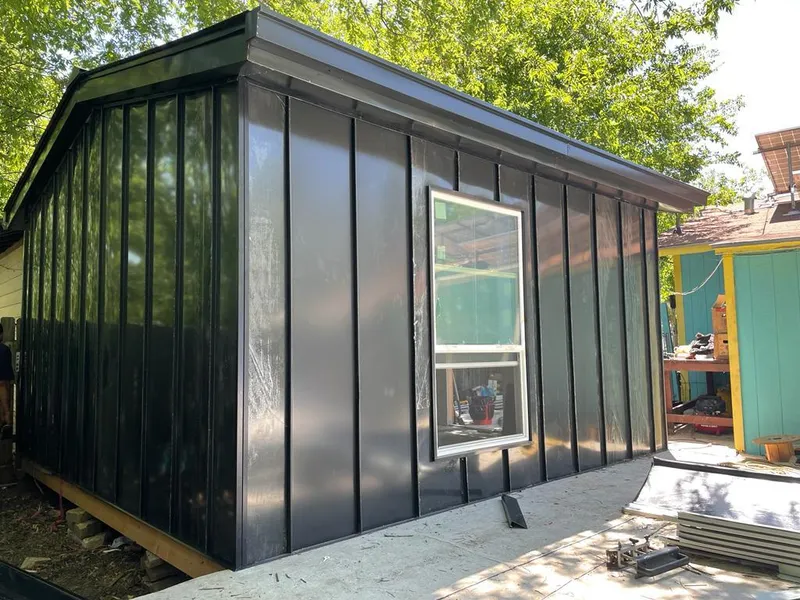 Black standing seam metal wall panels for Roof Inspection in Huntington Park