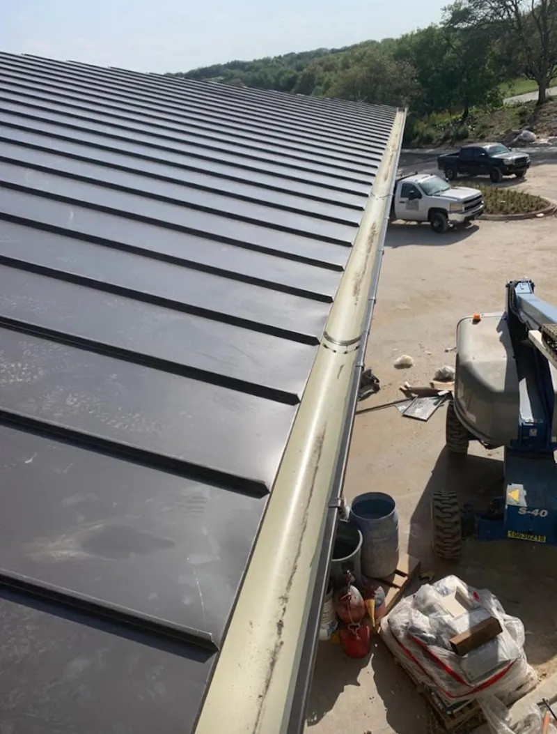 Standing seam panel and gutter detail on a metal roofing jobsite in Huntington Park